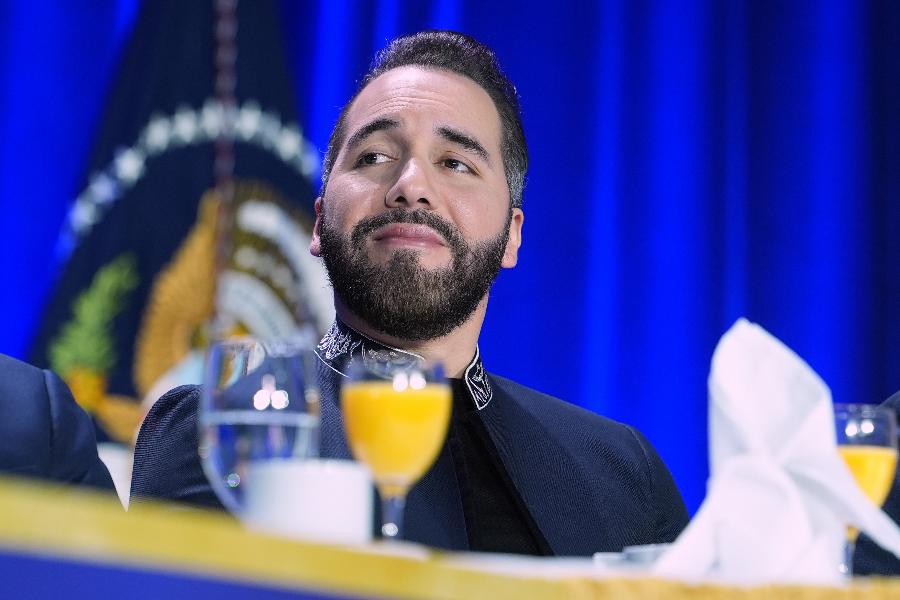 FILE - President of El Salvador, Nayib Armando Bukele Ortez, listens as President Donald Trump speaks during the National Prayer Breakfast, Feb. 5, 2026, in Washington. (AP Photo/Evan Vucci, File)