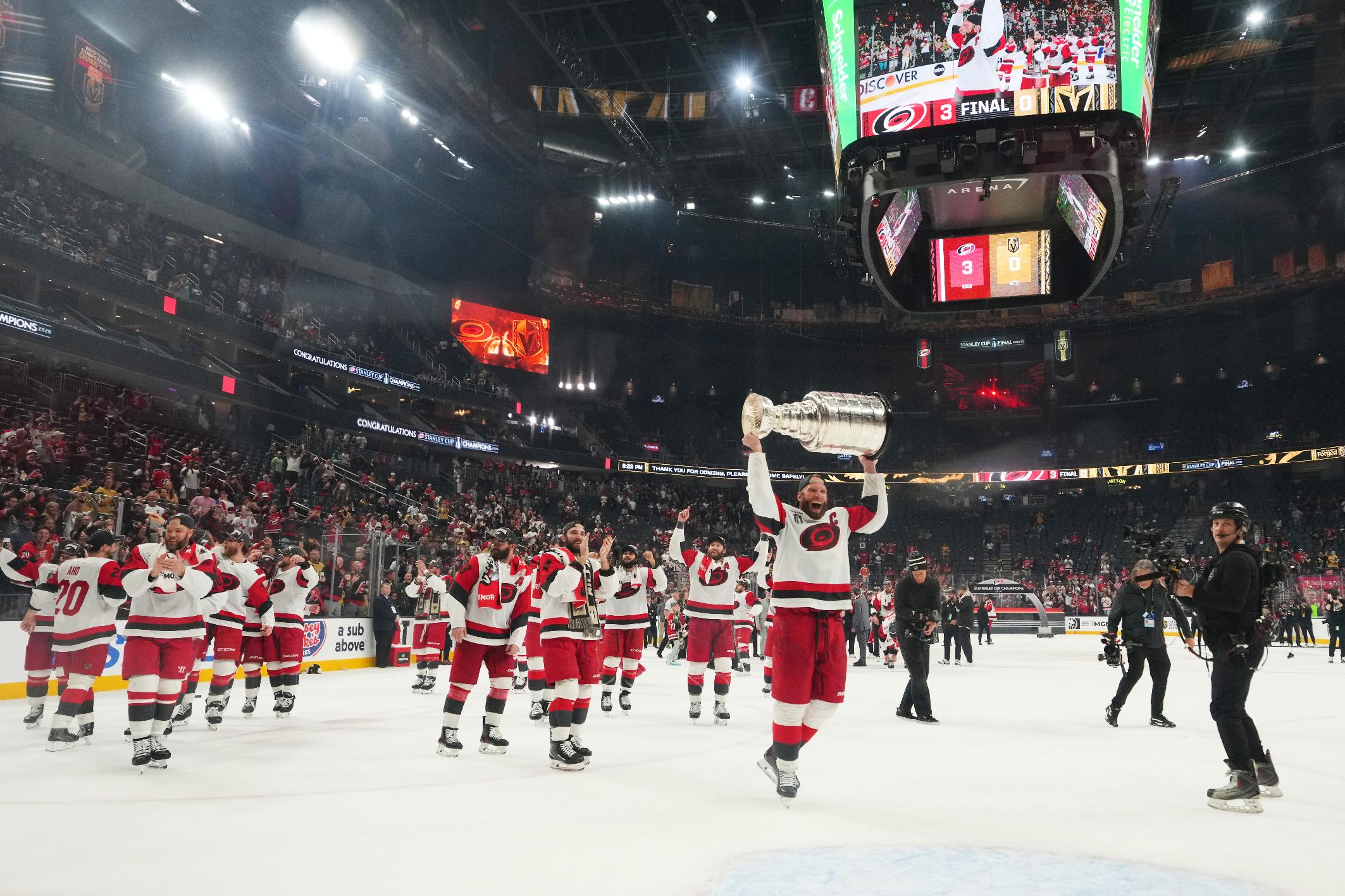 Carolina Hurricanes center Jordan Staal (11) lifts the Stanley Cup after a win over the Vegas Golden Knights in Game 6 of the NHL hockey Stanley Cup Final series, Sunday, June 14, 2026, in Las Vegas. (AP Photo/Candice Ward)