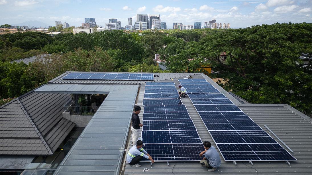 A team of solar installers set up a new rooftop solar system at a home in Manila, Philippines, on May 1, 2026. (AP Photo/Anton L. Delgado)