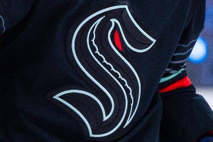 FILE - The logo of the Seattle Kraken is displayed on a player during an NHL hockey game in Seattle on Wednesday, March 4, 2026. (AP Photo/Maddy Grassy, File)