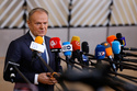 FILE - Poland's Prime Minister Donald Tusk speaks with the media as he arrives for the EU Summit in Brussels, Thursday, Dec. 18, 2025. (AP Photo/Geert Vanden Wijngaert, file)