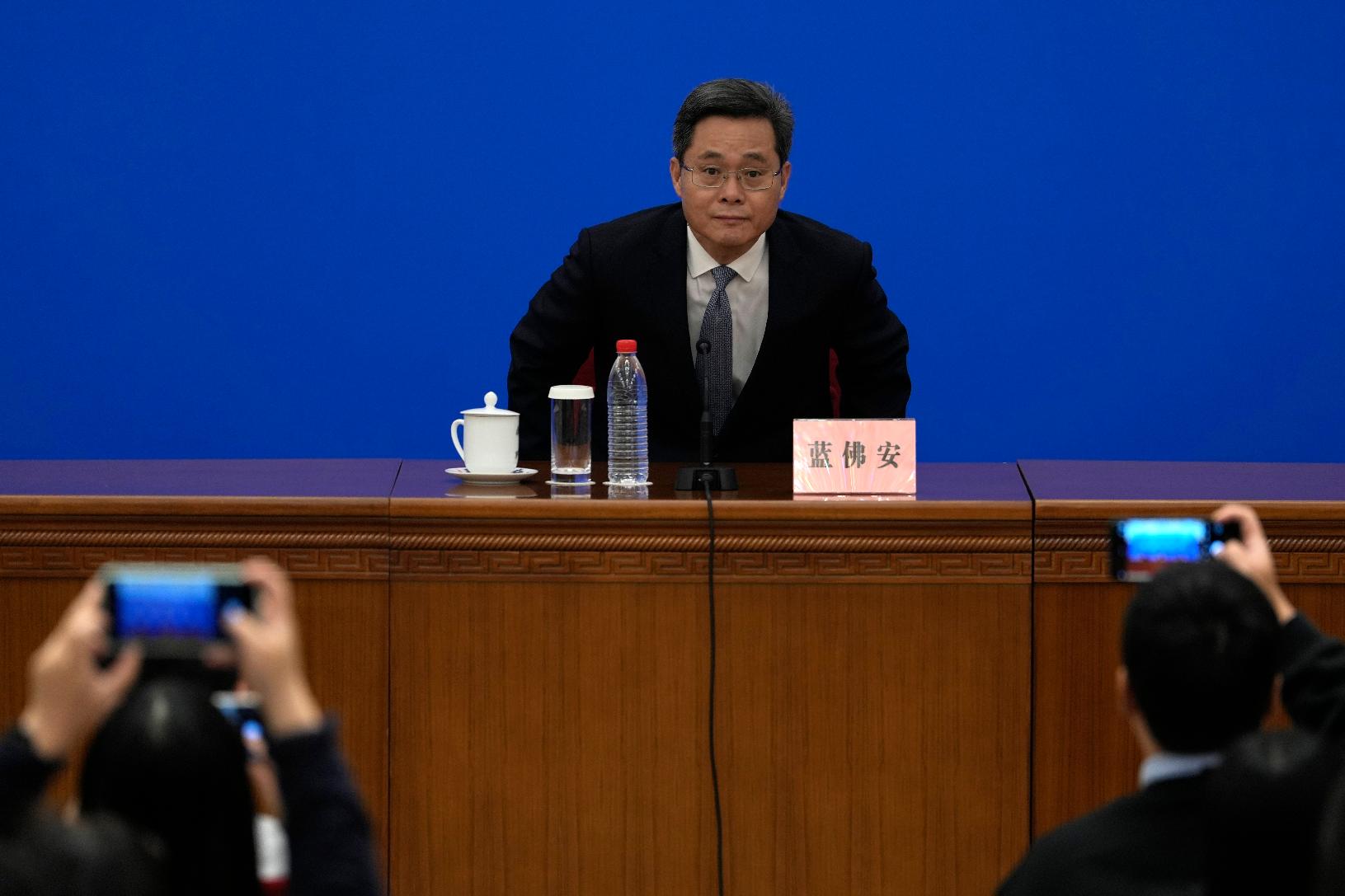 China's Finance Minister Lan Fo'an arrives at a press conference on a plan to boost the economy at the Great Hall of the People in Beijing, Friday, Nov. 8, 2024. (AP Photo/Ng Han Guan)
