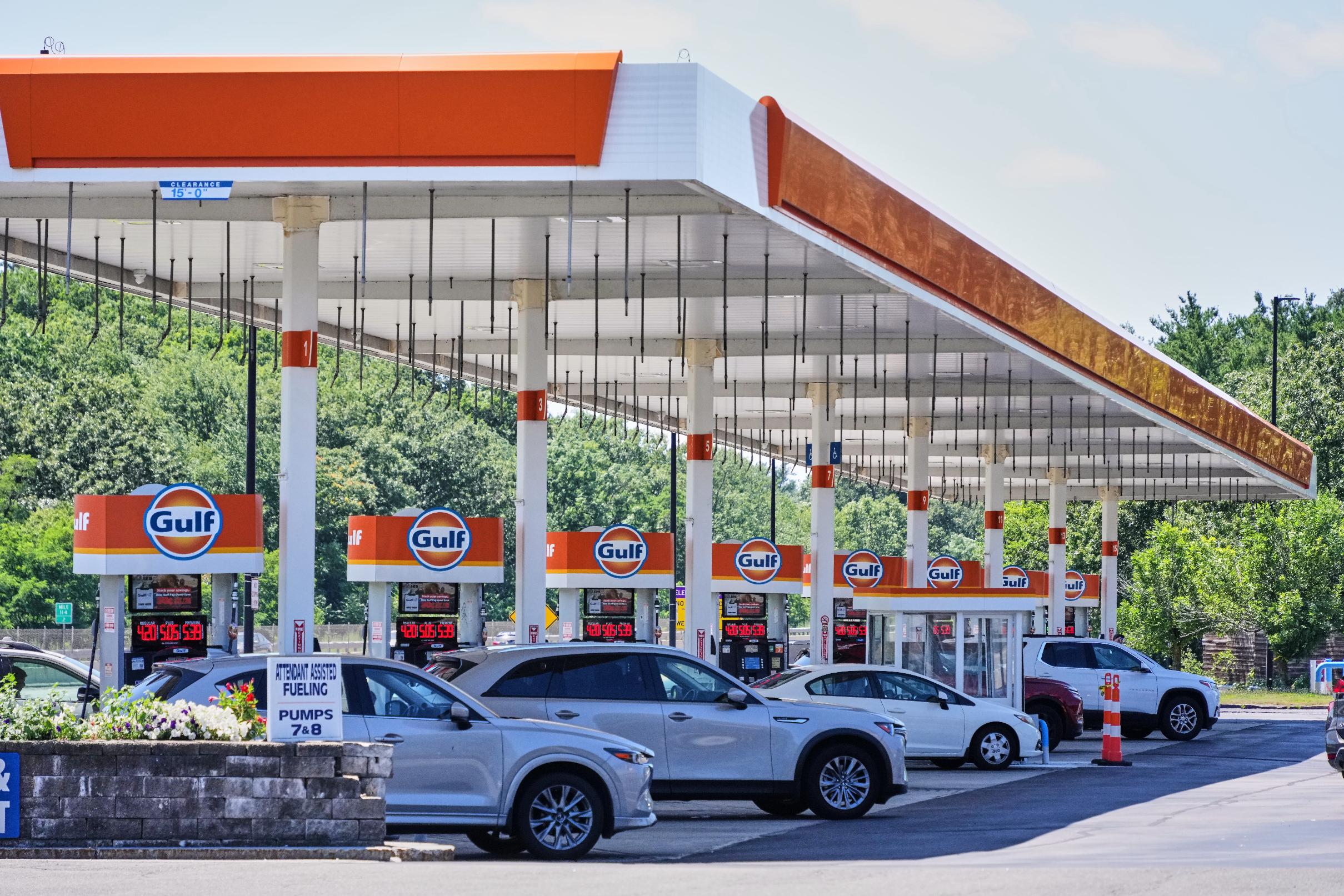 FILE - Cars line up at the pumps of a Gulf Oil station on the Massachusetts Turnpike near Boston Sunday, July 19, 2026. (AP Photo/Gene J. Puskar,File)