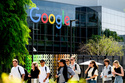 People walk through Google headquarters in Mountain View, Calif., on Thursday, March 26, 2026. (AP Photo/Noah Berger)