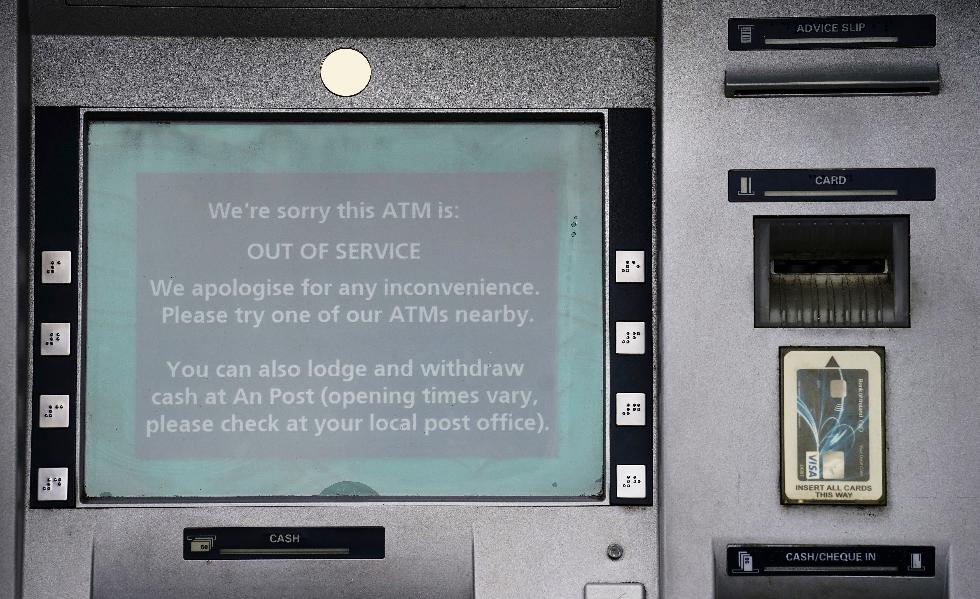 An out of service ATM at a Bank of Ireland branch in Finglas village, Dublin, Wednesday Aug. 16, 2023. Some Bank of Ireland customers were able to withdraw money they did not have Tuesday and early Wednesday, thanks to an hours-long technical glitch that also halted many of the bank’s online services. The outage allowed some customers to transfer and withdraw funds “above their normal limits,” the Bank of Ireland said. (Brian Lawless/PA via AP)
