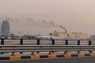 Smoke rises from the U.S. embassy building in Baghdad, Iraq, Saturday, March 14, 2026. (AP Photo/Ali Jabar)