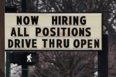 Hiring sign is displayed in front of a restaurant in Chicago, Thursday, Feb. 5, 2026. (AP Photo/Nam Y. Huh)
