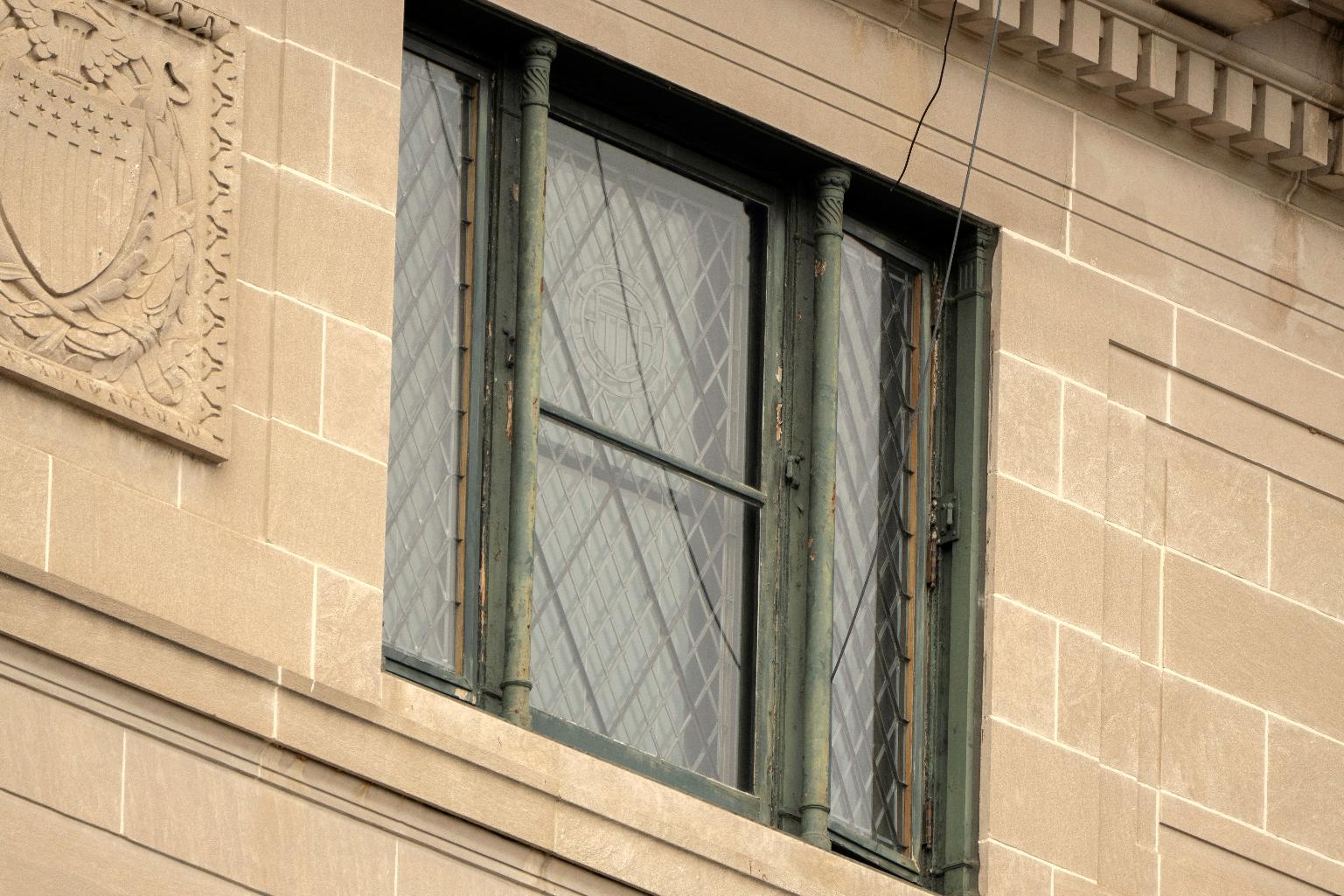 Wires are seen leading from a top floor corner window to the roof of the headquarters of the General Services Administration (GSA) Wednesday, April 2, 2025, in Washington. (AP Photo/Mark Schiefelbein)