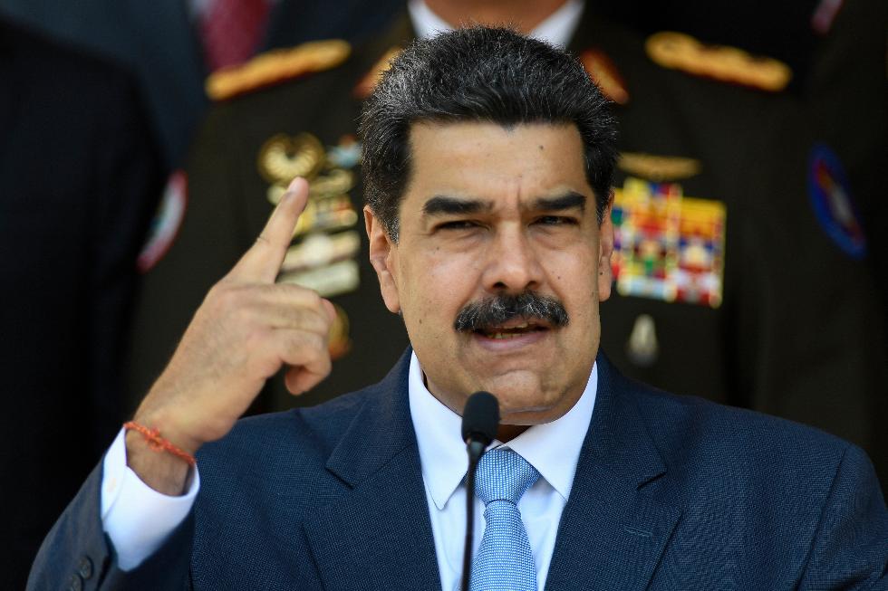 FILE - Venezuelan President Nicolas Maduro gives a press conference at the Miraflores presidential palace, March 12, 2020, in Caracas, Venezuela. (AP Photo/Matias Delacroix, File)