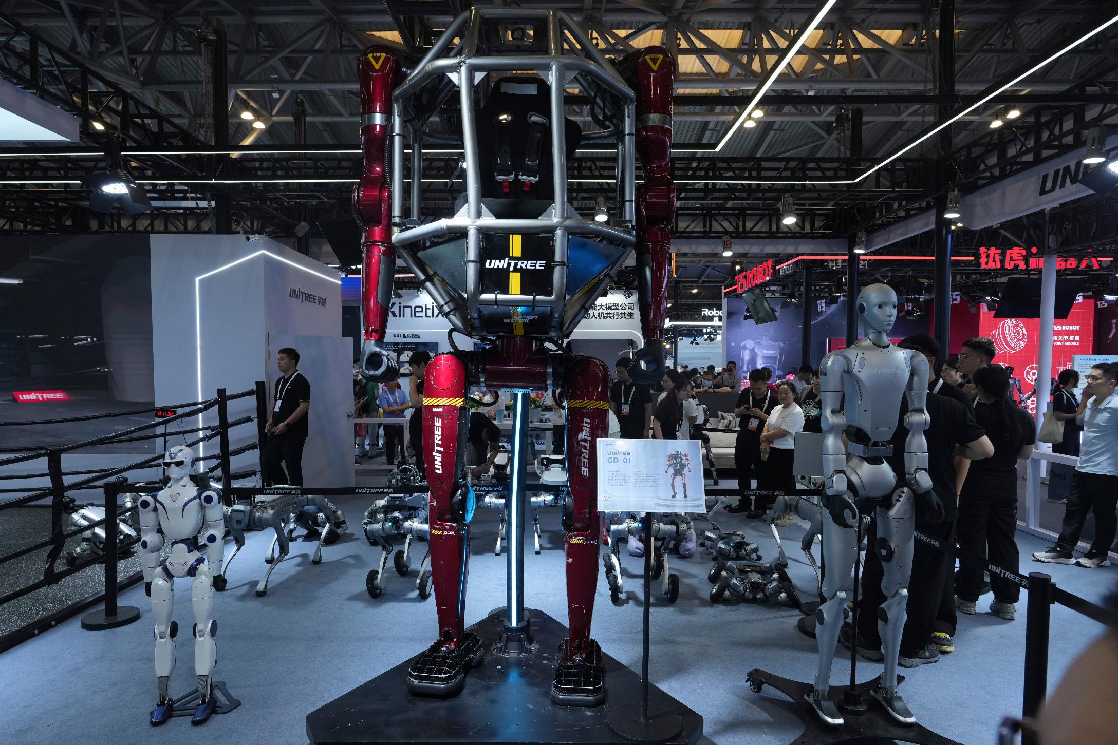A wide range of robots are displayed at a booth for leading Chinese commercial humanoid robotics firm Unitree Robotics during the World AI Conference in Shanghai, China, on July 17, 2026. (AP Photo/Ng Han Guan)