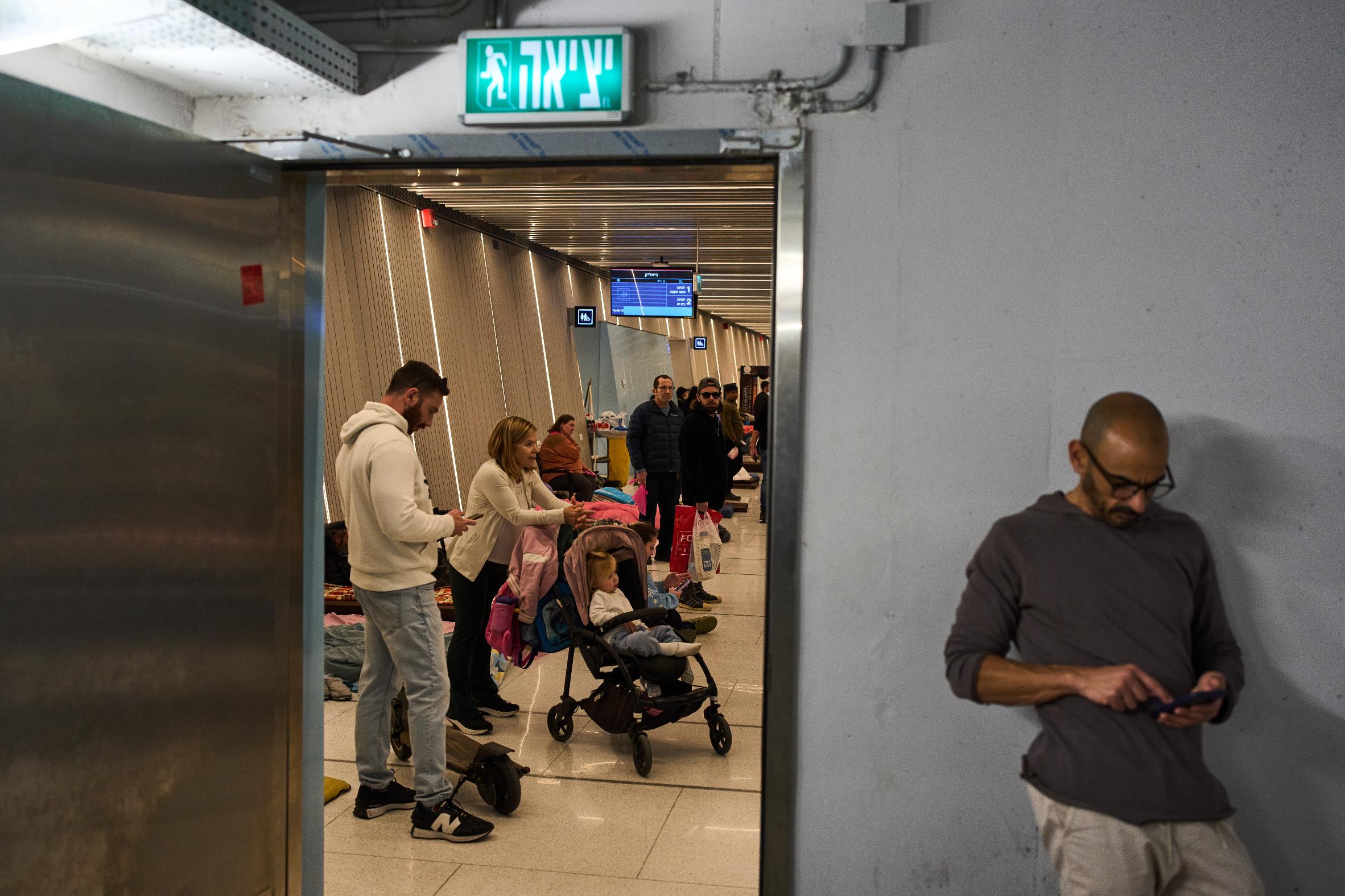People take shelter in an underground metro station as air raid sirens warn of incoming Iranian missile strike, in Ramat Gan, Israel, Tuesday, March 10, 2026. (AP Photo/Oded Balilty)