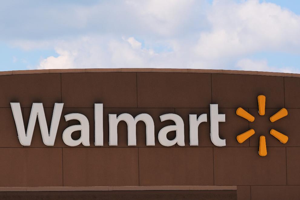 The Walmart logo is displayed on a store, Aug. 14, 2025, in Manchester, N.H. (AP Photo/Charles Krupa, File)