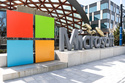FILE - A Microsoft sign and logo are displayed at the company's headquarters April 4, 2025, in Redmond, Wash. (AP Photo/Jason Redmond, File)