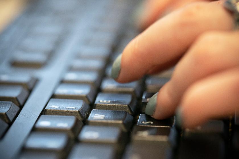 FILE - A person types on a computer keyboard in New York, Oct. 8, 2019. (AP Photo/Jenny Kane, File)