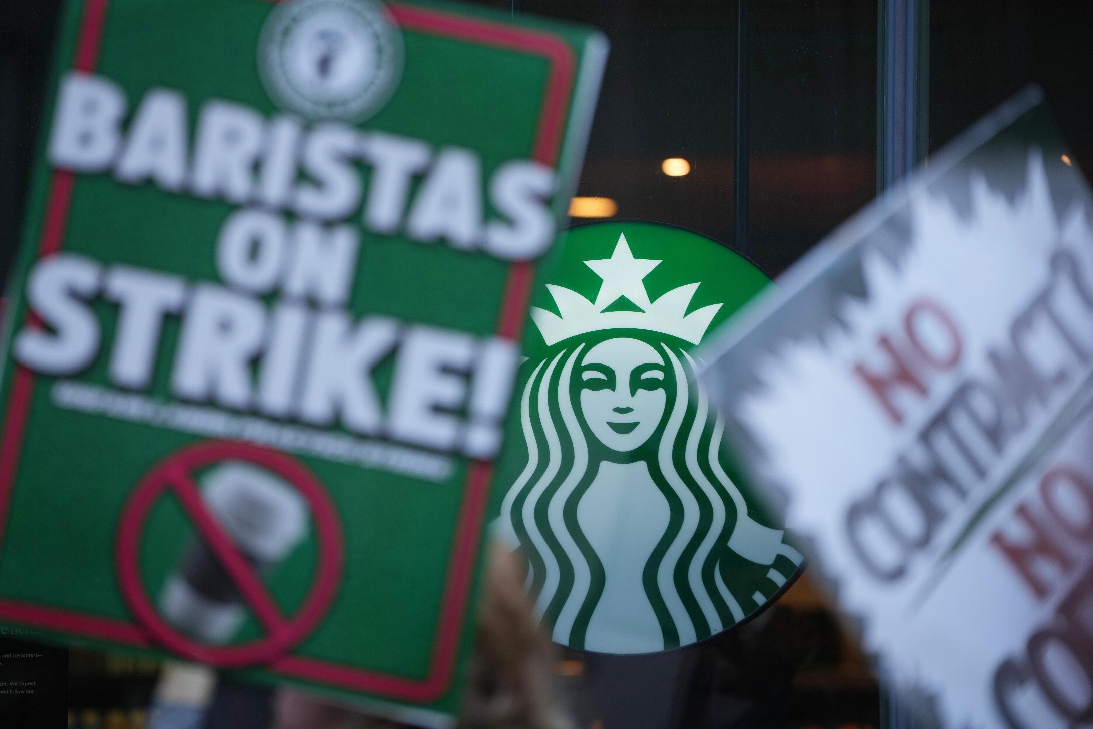 Protesters picket outside a Starbucks, Thursday, Nov. 13, 2025, in Philadelphia. (AP Photo/Matt Slocum)