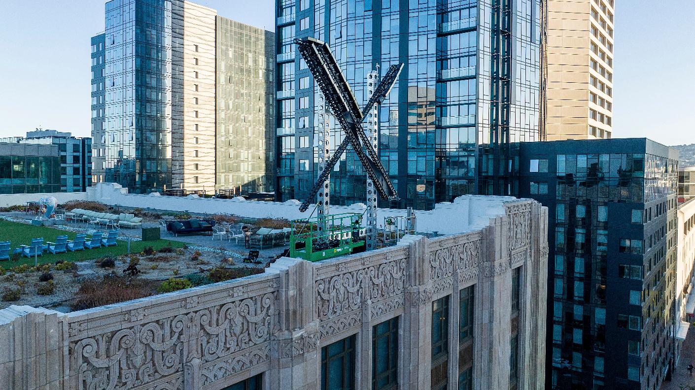 FILE - An "X" sign rests atop the company headquarters, formerly known as Twitter, in downtown San Francisco, on Friday, July 28, 2023. (AP Photo/Noah Berger, File)