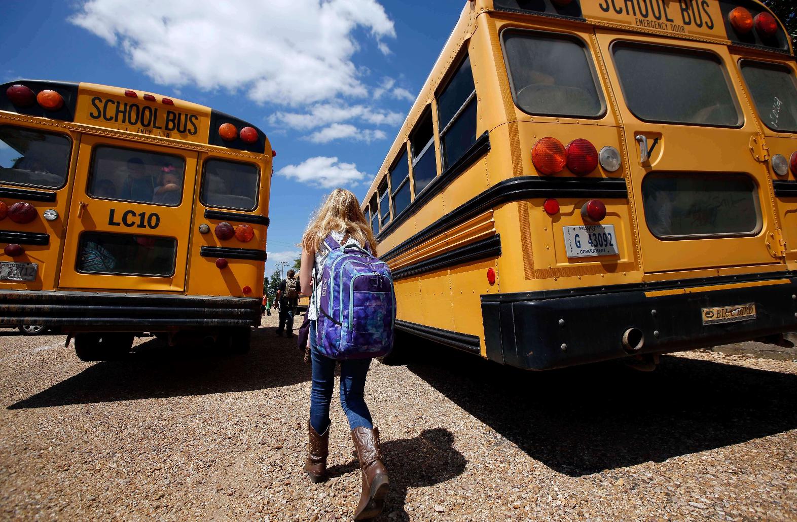 FILE - A student prepares to leave school, Aug. 13, 2014, southeast of Brookhaven, Miss. (AP Photo/Rogelio V. Solis, File)