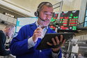 Options trader Justin Kanda works on the floor of the New York Stock Exchange, Thursday, May 7, 2026. (AP Photo/Richard Drew)