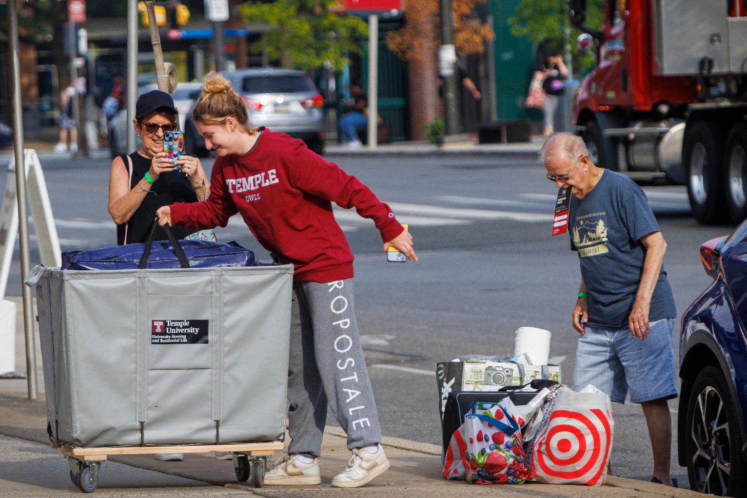 FILE - Emily Danenhower, 17, loads her container as grandparents Rena Ruben and Walter McClain help move her into college as students moved into their dorms during move-in-day at Temple University in Philadelphia, on Monday, Aug. 21, 2023. (Alejandro A. Alvarez/The Philadelphia Inquirer via AP, File)