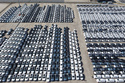 FILE -An aerial view of new cars awaiting export to oversea markets is seen at a port in Shanghai, March 10, 2026. (Chinatopix via AP, File)