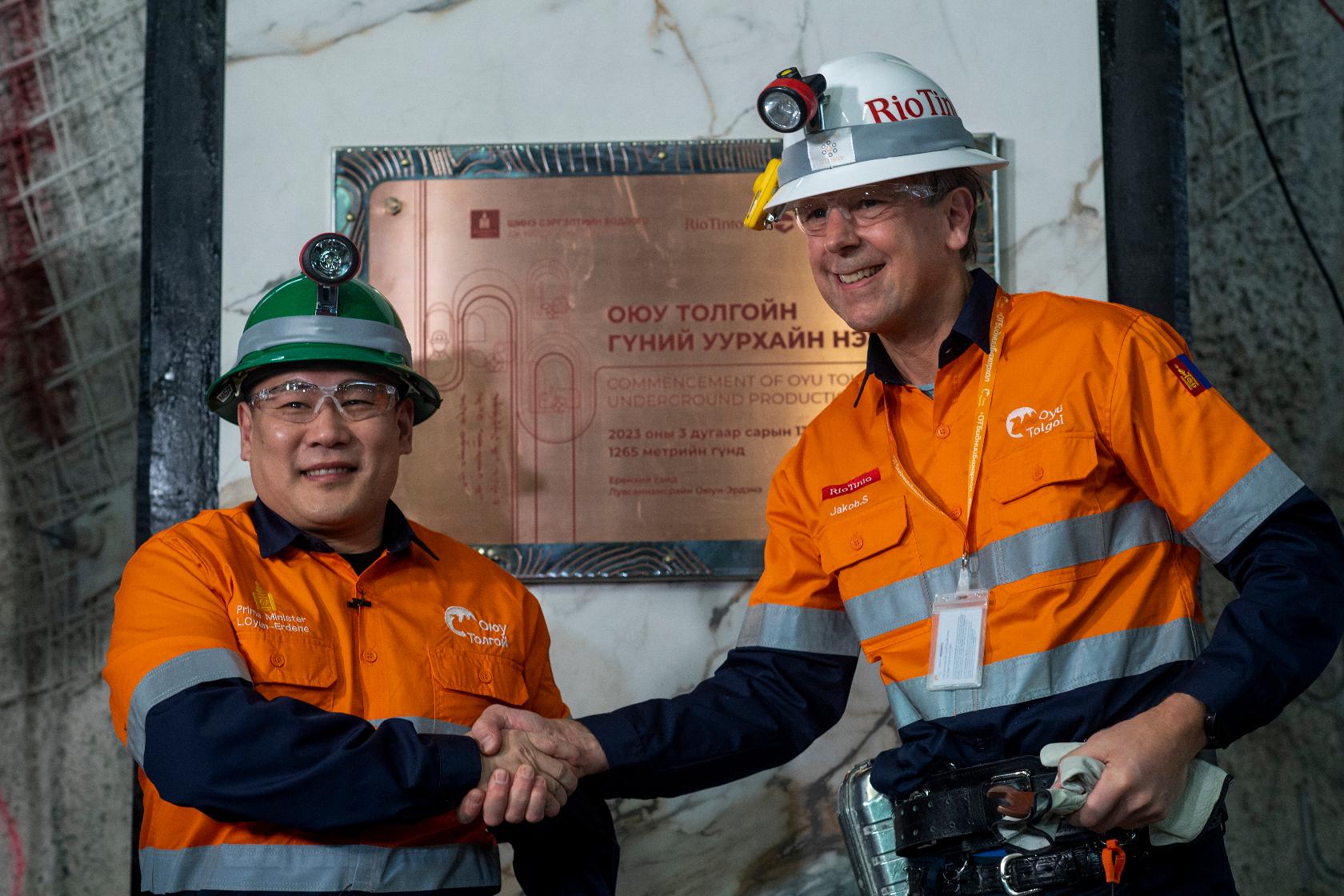 IIn this photo released by Rio Tinto, Mongolian Prime Minister Luvsannamsrain Oyun-Erdene, left, shakes hands with Rio Tinto's Chief Executive Jakob Stausholm during the start of underground production at the Oyu Tolgoi mine in Khanbogd village, Umnugobi province, Mongolia Monday, March 13, 2023. Mongolia plans to channel revenue from rising copper exports into an economic development fund to reap more benefit from its mineral riches and root out corruption, the North Asian nation's prime minister said Tuesday, following the opening of a major expansion of its biggest mine. (Rio Tinto via AP)