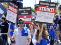Demonstrators take part in a rally in front of the entrance to the Paramount Pictures studio, Tuesday, May 2, 2023, in Los Angeles. Television and movie writers launched a strike for the first time in 15 years, as Hollywood girded for a walkout with potentially widespread ramifications in a fight over fair pay in the streaming era. (AP Photo/Chris Pizzello)