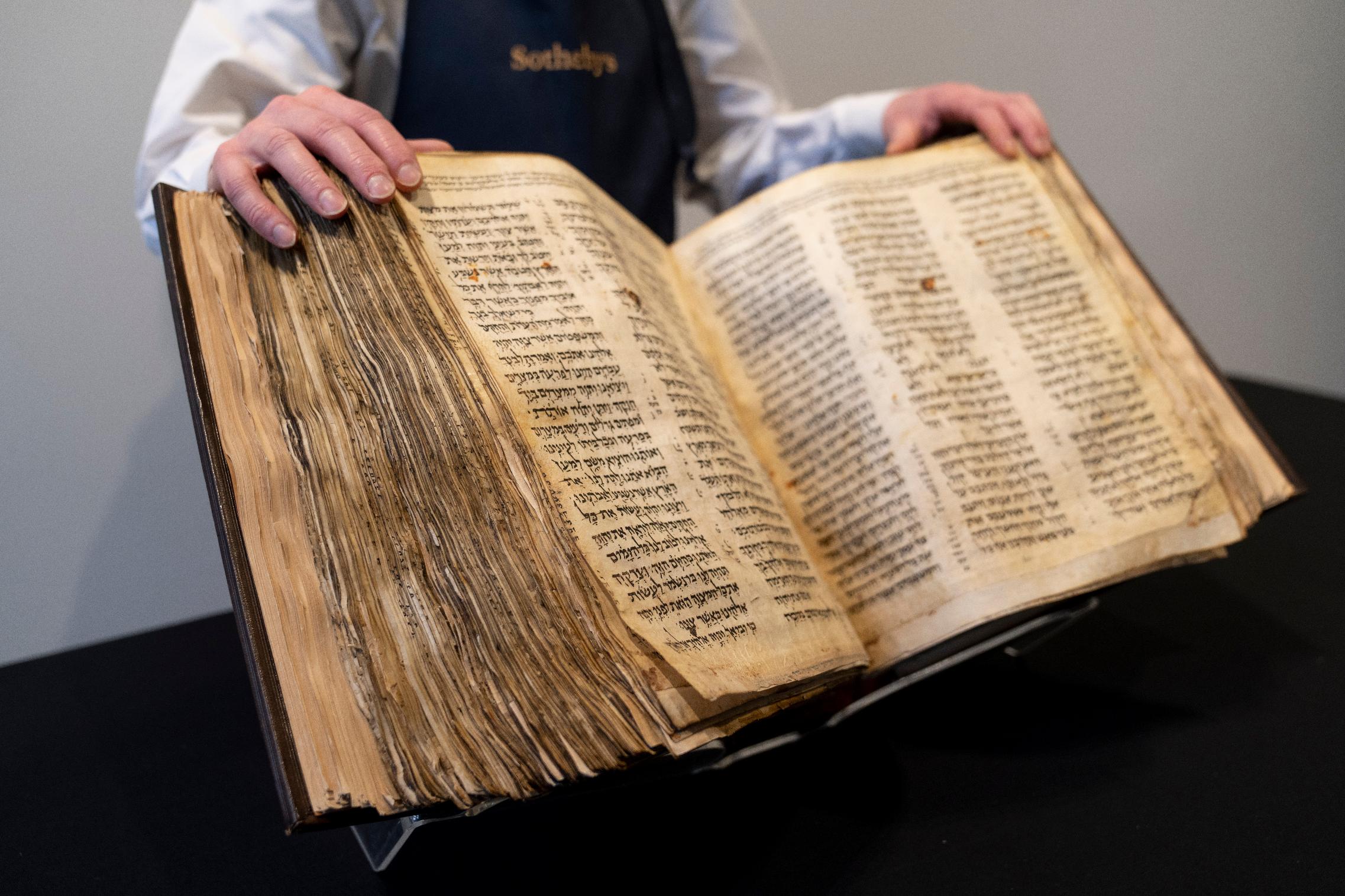FILE - Sotheby's unveils the Codex Sassoon for auction, Wednesday, Feb. 15, 2023, in the Manhattan borough of New York. The 1,100-year-old Hebrew Bible that is one of the oldest surviving biblical manuscripts sold for $38.1 million, which includes the auction house's fee, Wednesday, May 17, 2023, in New York. (AP Photo/John Minchillo, File)