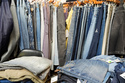 Piles of denim sit in the showroom of BPD Washhouse, a denim processing facility, in Jersey City, N.J., Tuesday, May 5, 2026. (AP Photo/Seth Wenig)