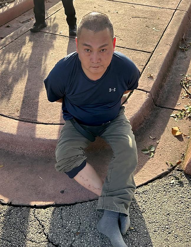This photo released by the U.S. Marshals Service shows Wu Chen following his arrest by the Miami Beach Police on Tuesday, Nov. 22, 2022, in South Florida. Police said Wu is a suspect in the weekend killings of four people at a marijuana farm in Oklahoma. (U.S. Marshals Service via AP)