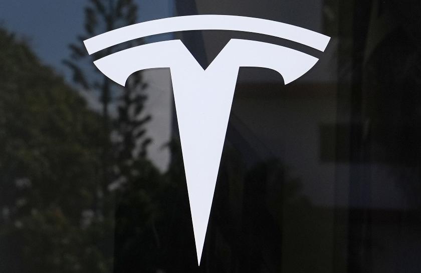 FILE - The Tesla logo is displayed at a Tesla dealership, Mar. 13, 2025, in Miami. (AP Photo/Lynne Sladky, File)