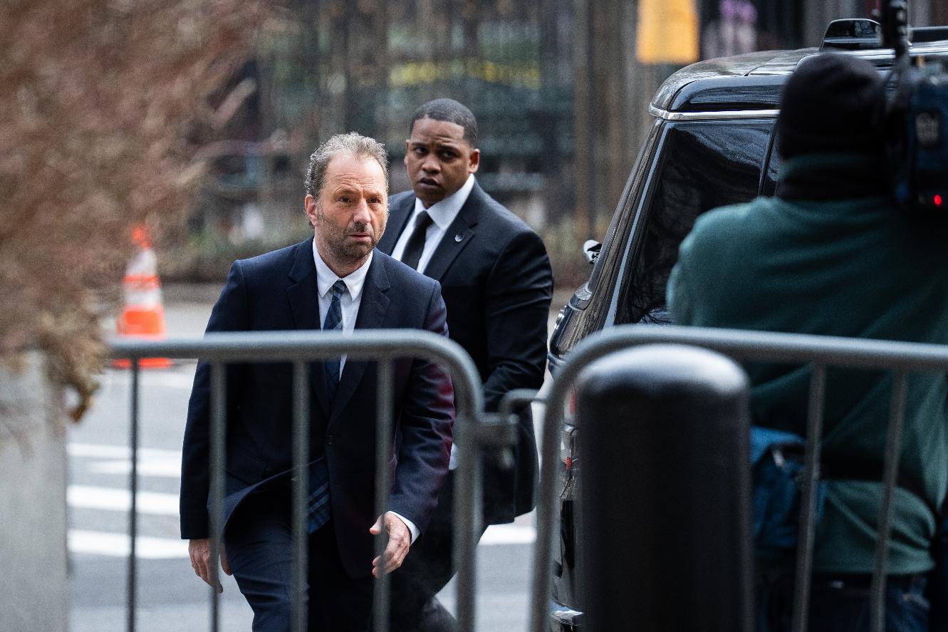 Michael Rapino, left, chief executive officer and president of Live Nation Entertainment Inc., arrives at Manhattan Federal court, Thursday, March 19, 2026 in New York. (AP Photo/Adam Gray)