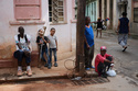 People hang out on the sidewalk during a blackout in Havana, Tuesday, March 17, 2026. (AP Photo/Ramon Espinosa)
