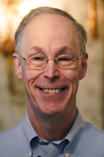 Douglas W. Diamond poses for photographers in the lobby of his residence after winning the 2022 Nobel Prize for Economics Monday, Oct. 10, 2022, in Chicago. (AP Photo/Charles Rex Arbogast)