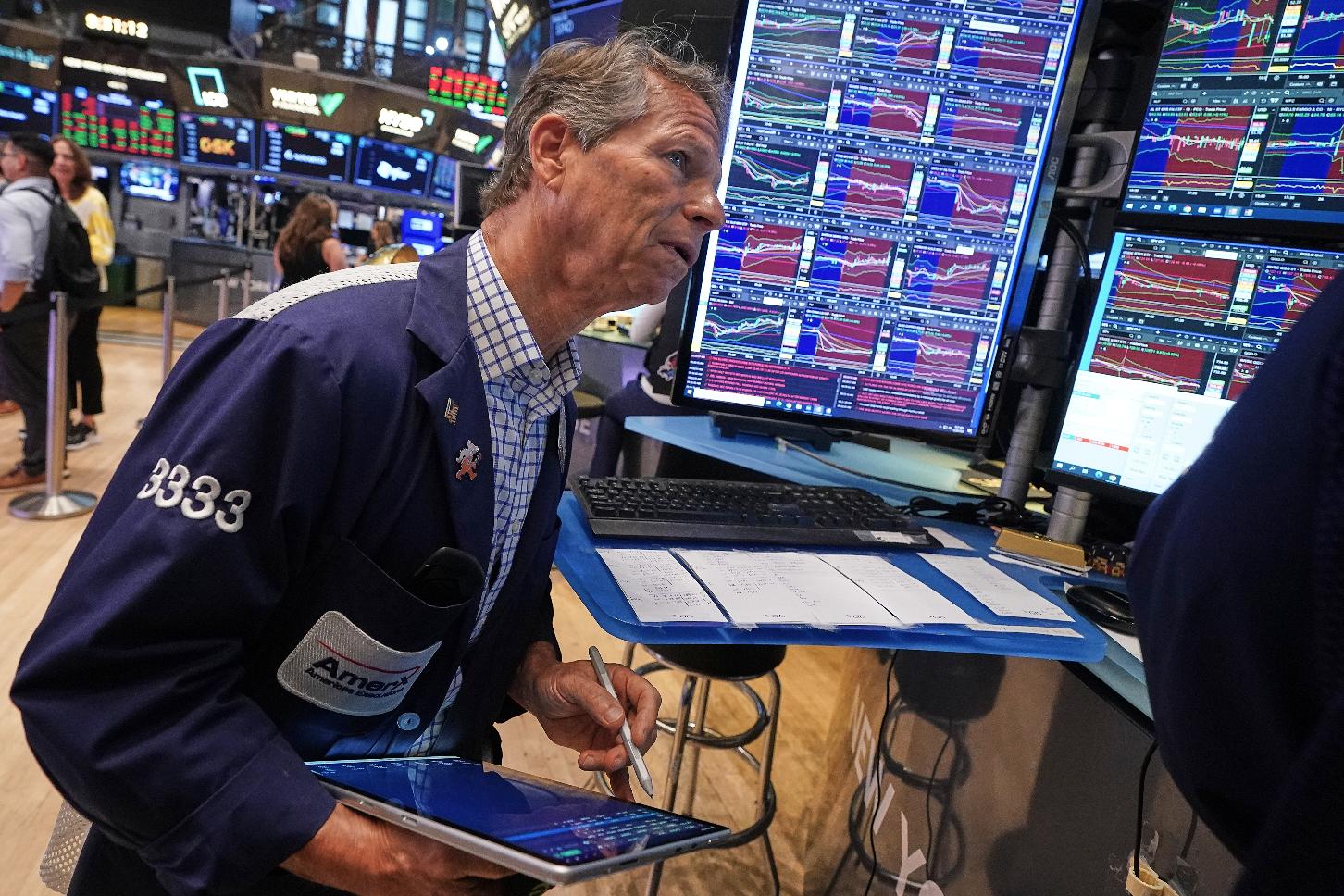 Trader Robert Charmak works on the floor of the New York Stock Exchange, Friday, June 26, 2026. (AP Photo/Richard Drew)