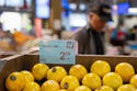 The price for sweet lime is displayed as a customer shops in the produce section of a grocery store on Monday, May 11, 2026, in Portland, Ore. (AP Photo/Jenny Kane)
