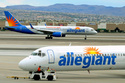 File - In this May 9, 2013, file photo, two Allegiant Air jets taxi at McCarran International Airport in Las Vegas. (AP Photo/David Becker, File)