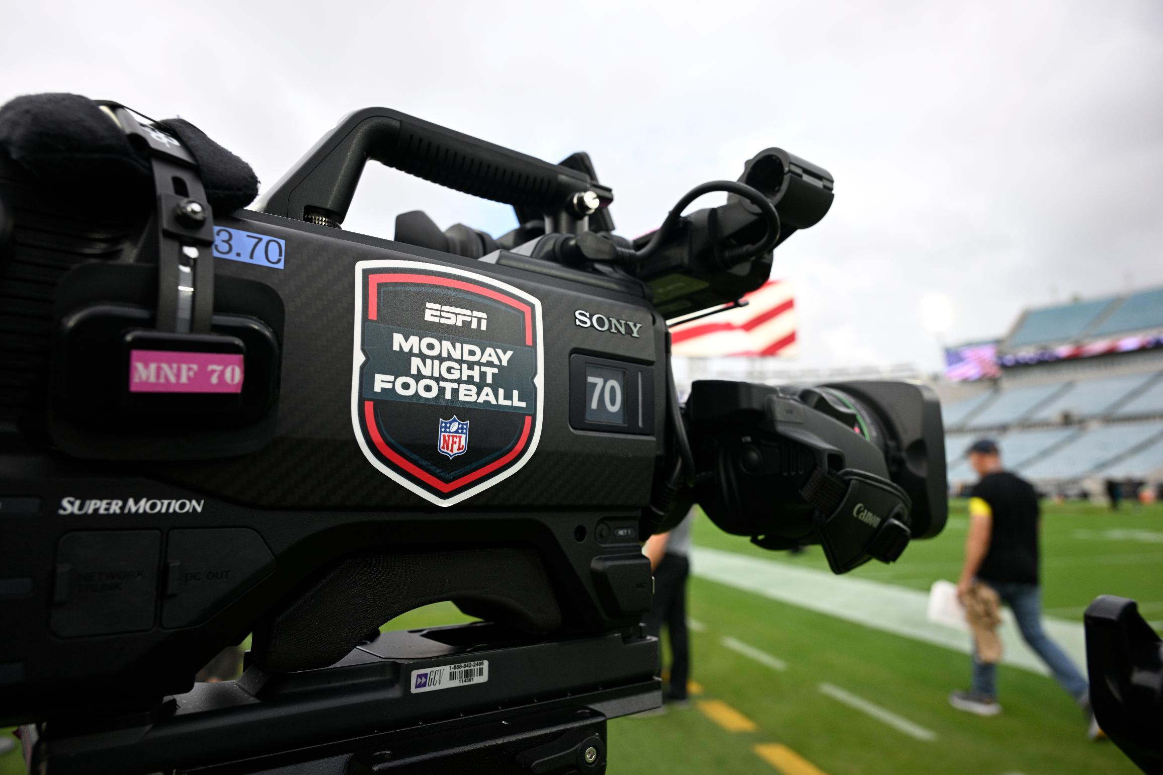 FILE - An ESPN Monday Night Football logo is viewed on a broadcast camera before an NFL football game between the Jacksonville Jaguars and the Kansas City Chiefs, Monday, Oct. 6, 2025, in Jacksonville, Fla. (AP Photo/Phelan M. Ebenhack, File)