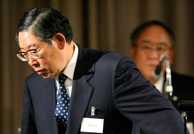 FILE - Outgoing chairman of the Japan's foremost business lobby, the Nippon Keidanren, Hiroshi Okuda, left, leaves the podium following his one and the last speech as a chairman as newly named chairman Fujio Mitarai, Canon Corps Chief Executive Officer looks on during the annual meeting in Tokyo, May 24, 2006. (AP Photo/Junji Kurokawa, File)