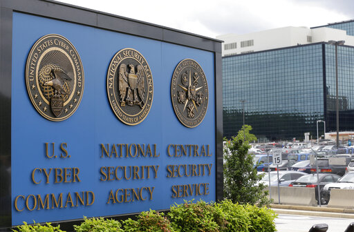 FILE - The sign outside the National Security Administration (NSA) campus in Fort Meade, Md., June 6, 2013. A new report says cyber criminal gangs are getting increasingly adept at hacking and becoming more professional. The report by the United States, Australia and the United Kingdom paints a bleak picture of ransomware trends in 2021, with ransomware operators even setting up an arbitration system to resolve payment disputes among themselves.  (AP Photo/Patrick Semansky, File)
