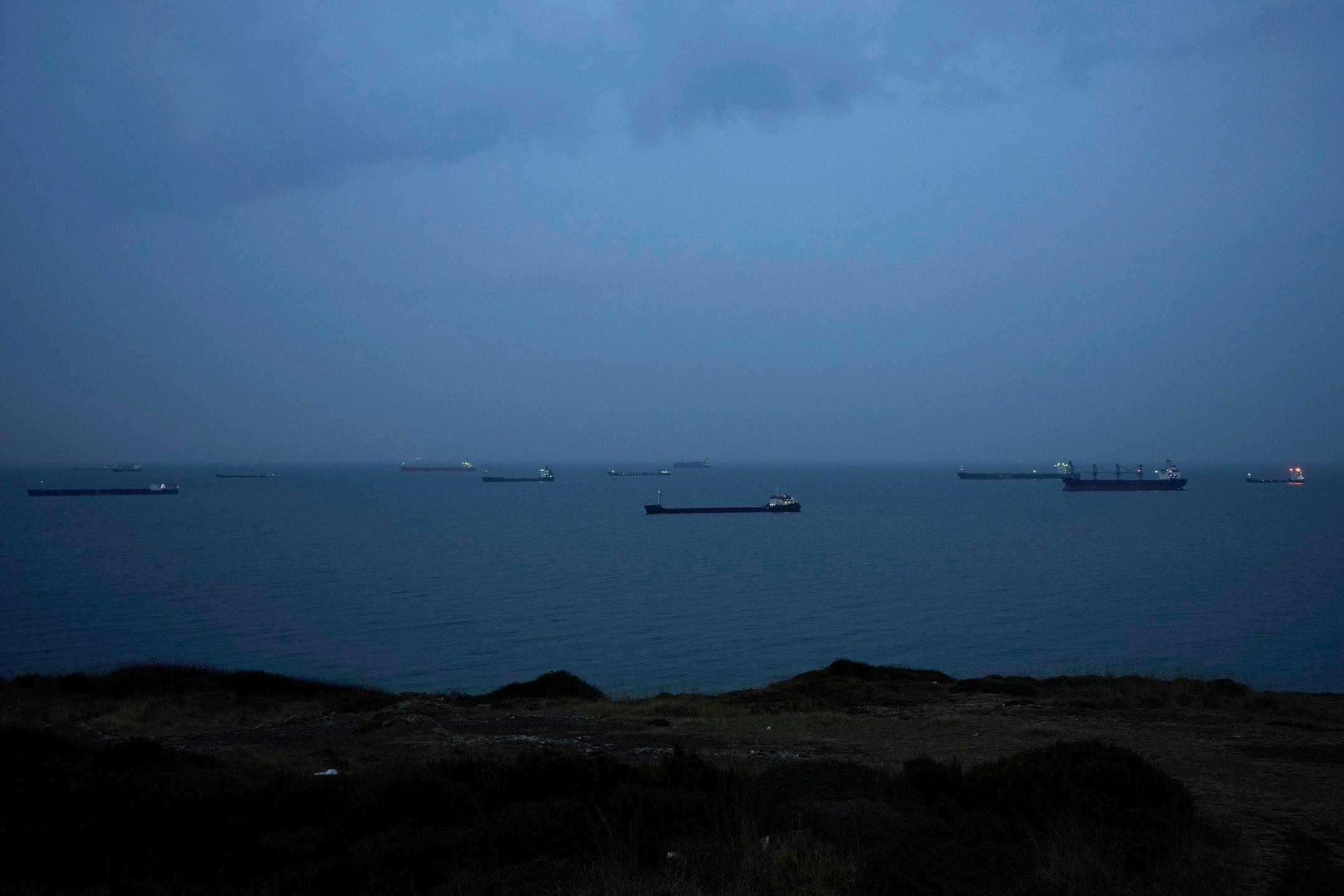 FILE - Cargo ships anchor at the Black Sea wait to cross the Bosporus strait in Istanbul, Turkey, on Nov. 17, 2022. The United Nations is racing to extend a deal that has allowed for shipments of Ukrainian grain through the Black Sea to parts of the world struggling with hunger, helping ease a global food crisis exacerbated by the war that Russia launched more than a year ago.(AP Photo/Khalil Hamra, File)