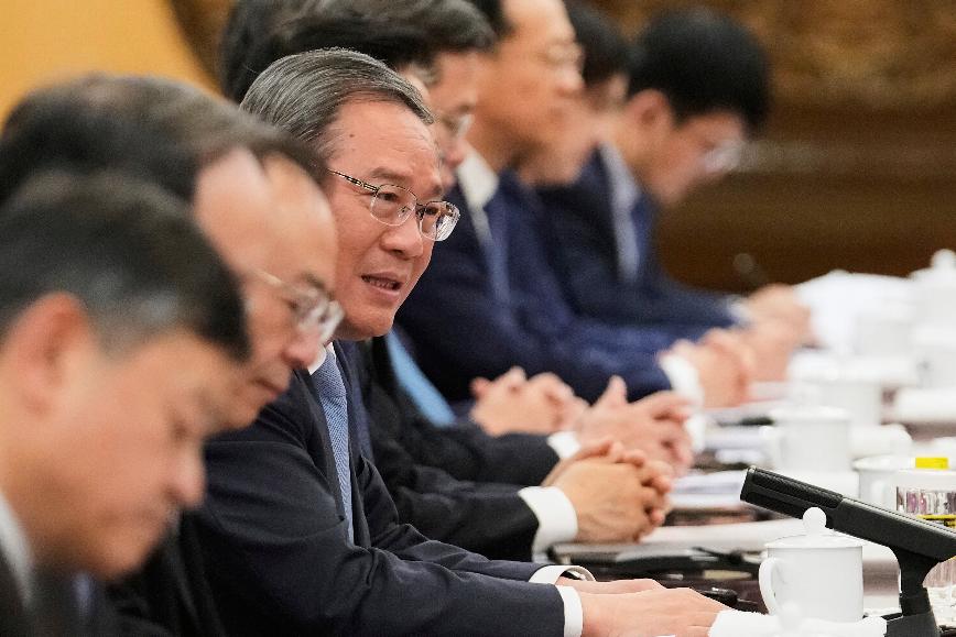 Chinese Premier Li Qiang, center, speaks during the opening remarks meeting with European Commission President Ursula von der Leyen and others during the EU-China summit at the Great Hall of the People in Beijing, China, Thursday, July 24, 2025. (AP Photo/Mahesh Kumar A., Pool)