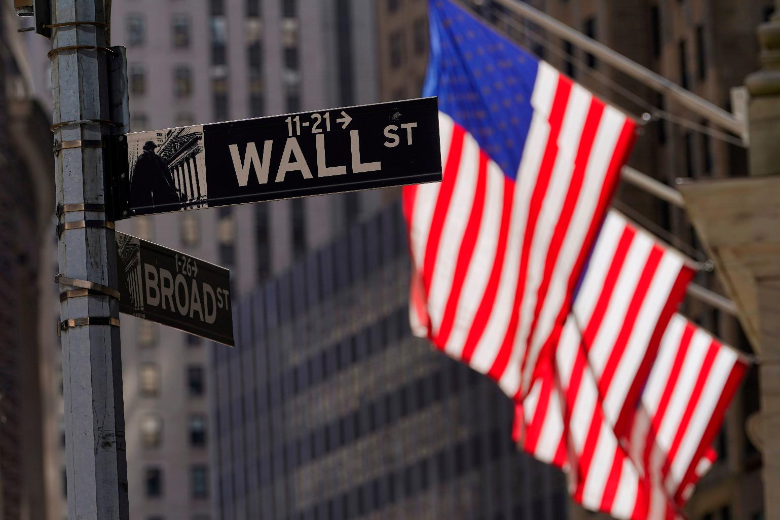 FILE - American flags fly outside the New York Stock Exchange, Friday, Sept. 23, 2022, in New York. (AP Photo/Mary Altaffer, File)