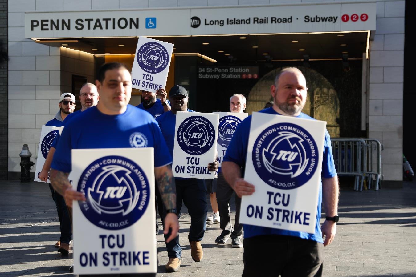Long Island Rail Road workers walk on the picket line outside of Penn Station on the first day of their strike, Saturday, May 16, 2026, in New York. (AP Photo/Heather Khalifa)