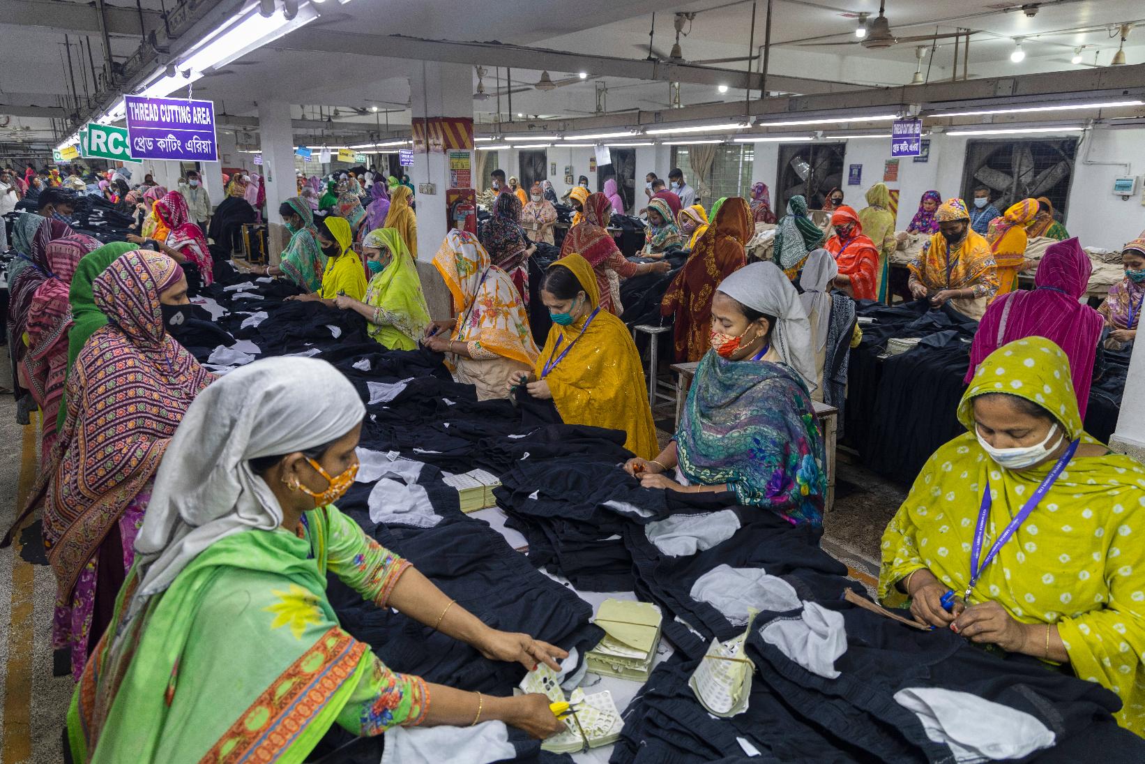 Women workers assemble apparel at a garment factory in Dhaka, Bangladesh, Tuesday, April 28, 2026. (AP Photo/Abdul Goni)