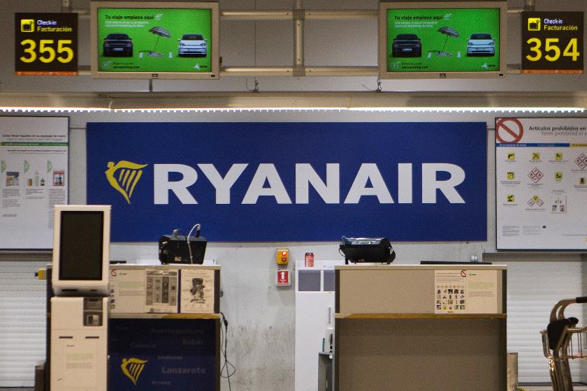 FILE - The Ryanair desk is seen, Aug. 10, 2018, at the Barajas airport in Madrid, Spain. (AP Photo/Paul White, File)