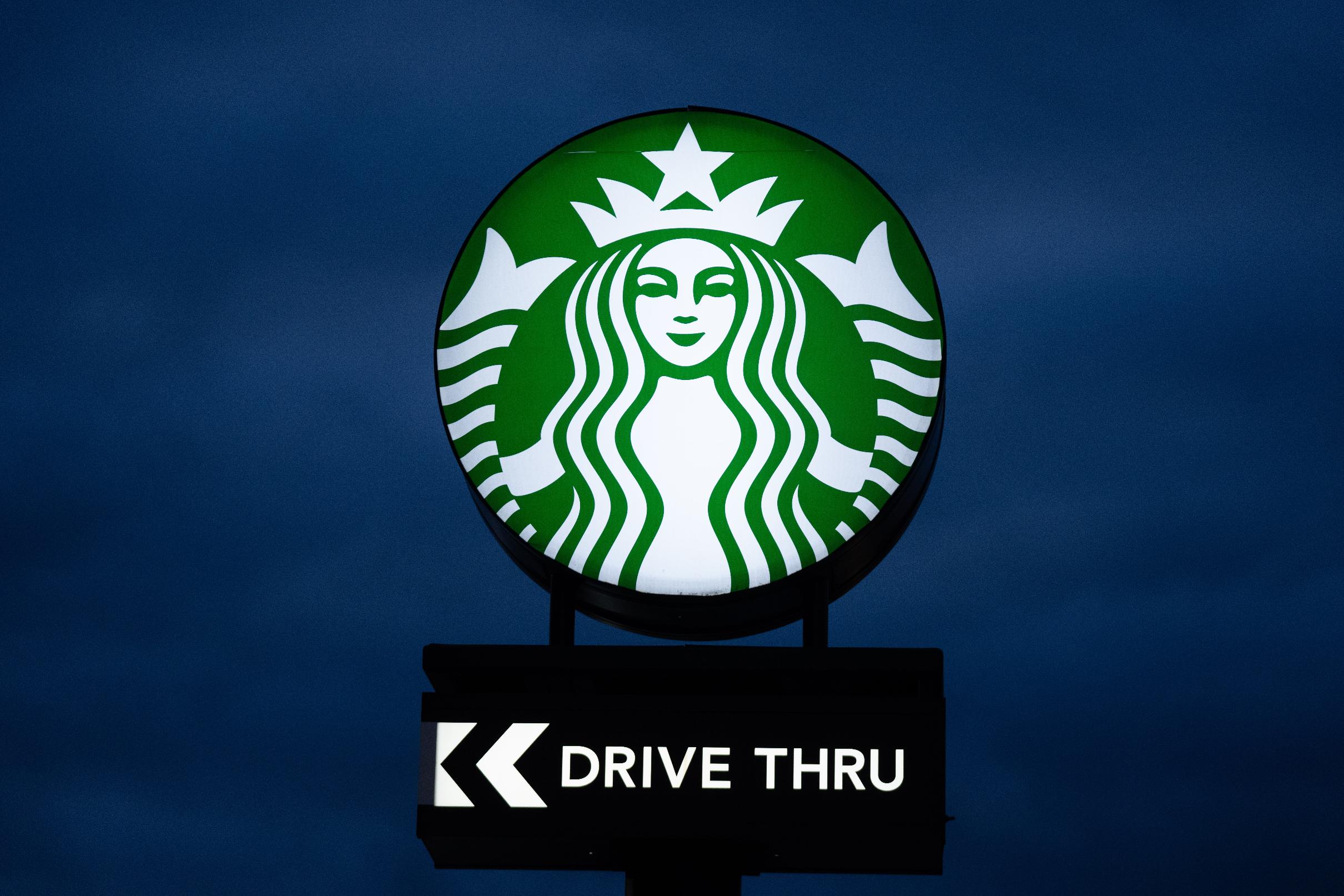 A sign for Starbucks is displayed outside store on Monday, April 27, 2026, in Portland, Ore. (AP Photo/Jenny Kane)