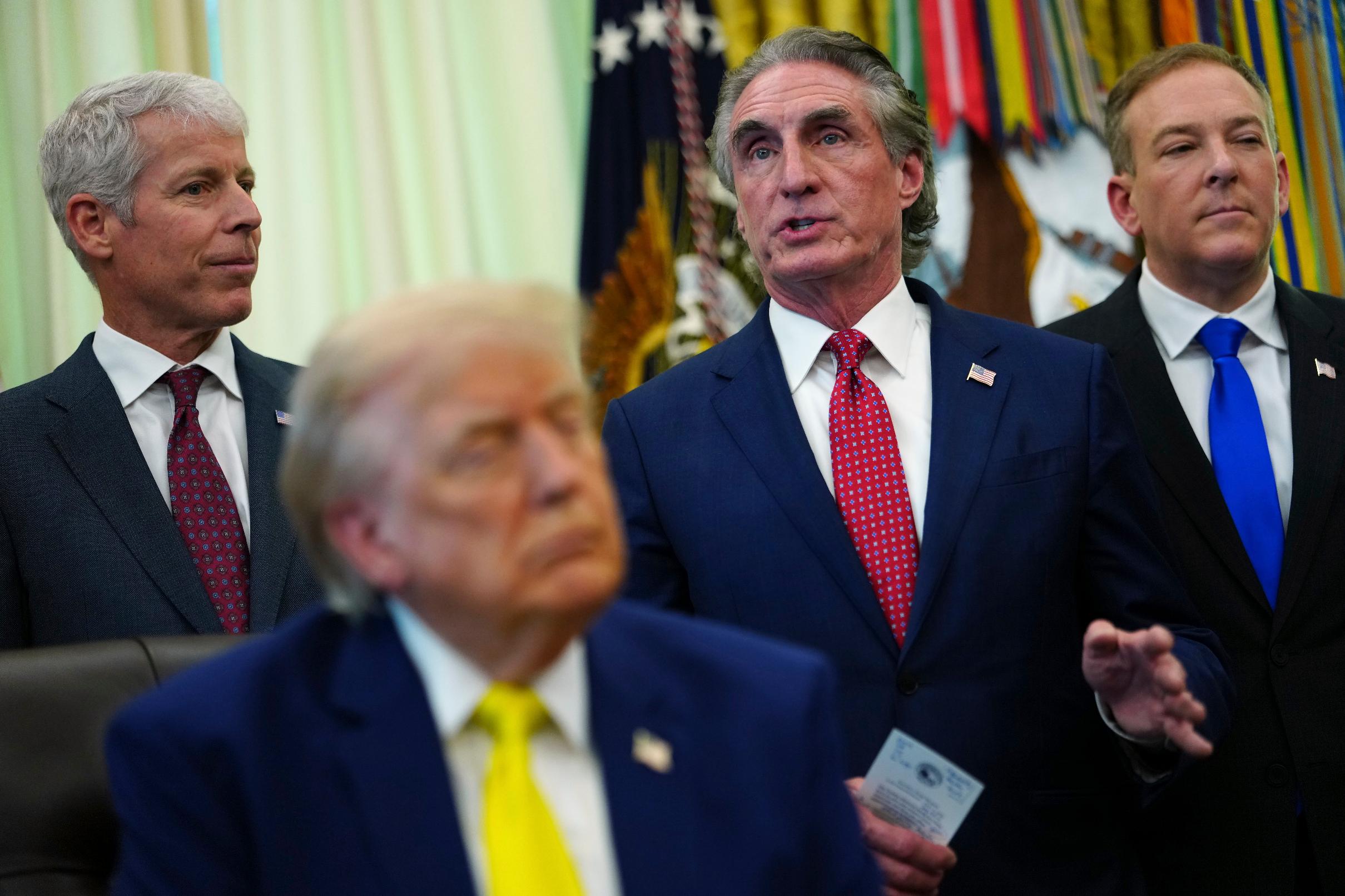 Interior Secretary Doug Burgum speaks as President Donald Trump, foreground, and from left, Energy Secretary Chris Wright and Environmental Protection Agency administrator Lee Zeldin, listen at an event about coal, Thursday, June 4, 2026, in the Oval Office of the White House in Washington. (AP Photo/Julia Demaree Nikhinson)