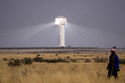 FILE - A shepherd watches livestock near Khi Solar One, a solar thermal plant that converts the sun's light energy into electricity, outside Upington, South Africa, in the Northern Cape province, Aug. 29, 2025. (AP Photo/Themba Hadebe, File)