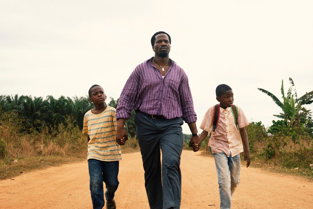 This image released by Mubi shows Godwin Egbo, from left, Ṣọpẹ́ Dìrísù, and Chibuike Marvellous Egbo in a scene from "My Father's Shadow." (Mubi via AP)