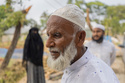 Sahidul Islam, center, the father of Mohammad Abdullah Al Mamun, stands with his relatives in Rasulpur village, Mymensingh district, Bangladesh, Friday, April 17, 2026.(AP Photo/Rajib Dhar)